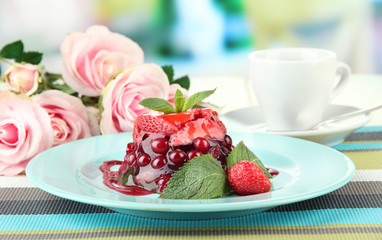 Tasty jelly dessert with fresh berries, on bright background