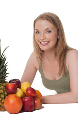 Blond young woman with assorted fruit