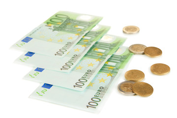 Euro banknotes and euro cents isolated on white