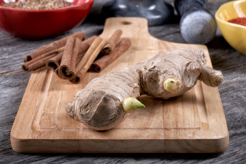 Still-life with ginger and cinnamon on an old kitchen table
