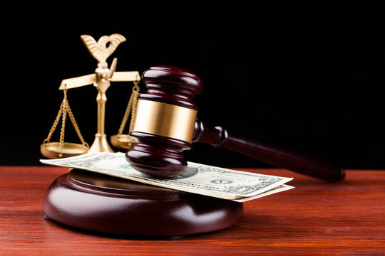 gavel, money , and scales of justice