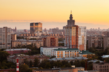 cityscape with yellow sunset sky