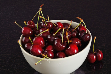 Red cherries in bowl