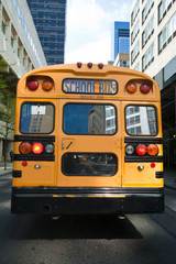 Naklejka na ściany i meble Typical yellow New York style school bus at New York City