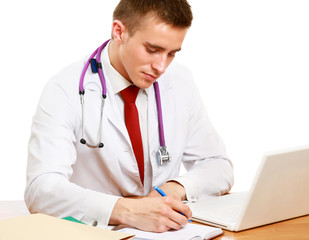 A male doctor working at desk, isolated on white background
