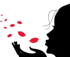 Silhouette of a girl who sends an air kiss