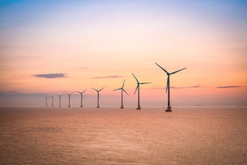 Naklejka premium offshore wind farm at dusk