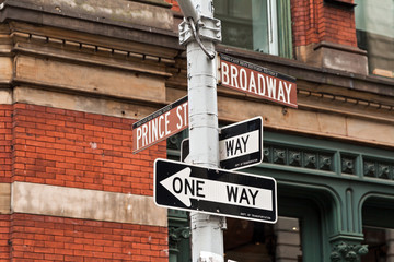 Street signs and traffic lights in New York, USA - obrazy, fototapety, plakaty