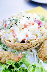 a delicious salad of fruits and prawns with sauce