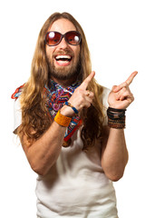 Happy and silly hippie man pointing up at copyspace.