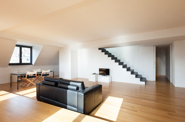 Interior, wide loft, hardwood floor, view living room