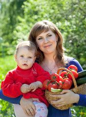 Happy woman and child with   vegetables