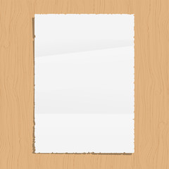 Empty paper sheet on wooden background