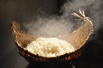 Hot sticky rice in old wooden steamer - Southeast Asian food 