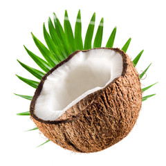 Coconut half with leaf on a white background