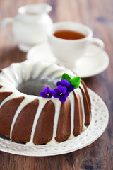 Chocolate bundt cake with icing, selective focus