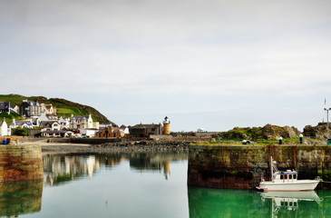 Fototapeta na wymiar View of Portpatrick harbour with boat