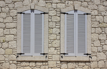 Wall of limestone masonry with windows
