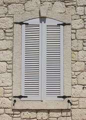 Wall of limestone masonry with window