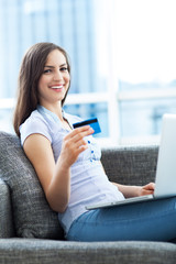 Woman with laptop and credit card