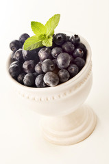 blueberries in a white porcelain bowl