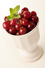 cherries in a white porcelain bowl