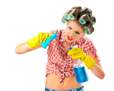 Housewife cleaning with spray