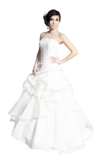 Fototapeta na wymiar bride in white dress standing isolated on white