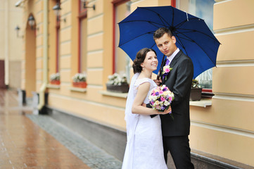 Happy wedding couple - bride and groom portrait outdoor