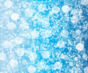 Bright glowing blue abstract background in the form of bokeh