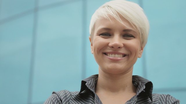 Portrait of happy business woman smiling at camera