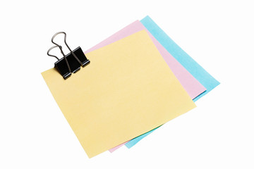 reminder note with color clothes pins on white background