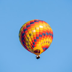 Colorful hot air balloon over blue sky
