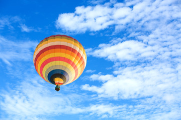 Colorful hot air balloon over blue sky