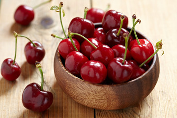 fresh cherries on wooden table
