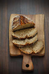 Spelt whole-grainflour bread, sliced on a board, breakfast