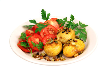 roasted potatoes with tomatoes.