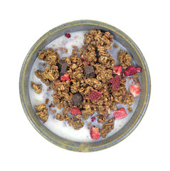 Breakfast granola in bowl with milk
