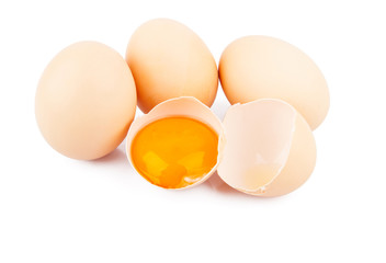 Chicken raw eggs, whole and broken on white, food photo