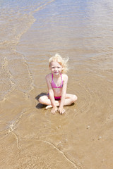 little girl on the beach at sea