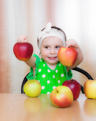 Fototapeta na wymiar Happy Kid with apples.