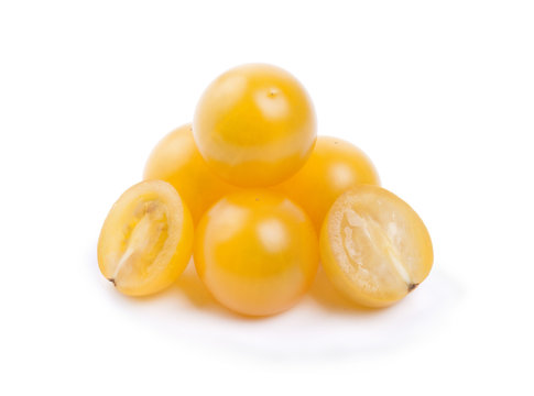yellow cherry tomatoes on a white background