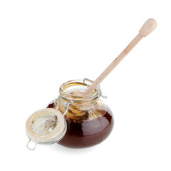 Jar of honey with wooden drizzler