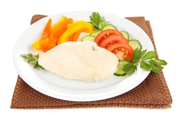 Boiled chicken breast on plate with vegetables isolated on