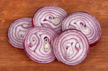 Fototapeta na wymiar Purple onion on wooden background