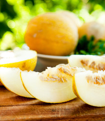 melon sliced a on wooden table