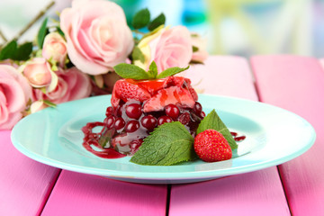 Tasty jelly dessert with fresh berries, on bright background