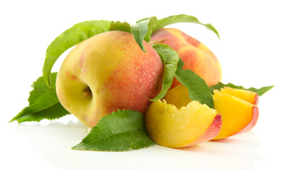 Ripe sweet peaches with leaves, isolated on white