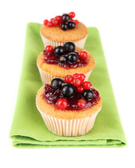 Tasty muffins with berries isolated on white