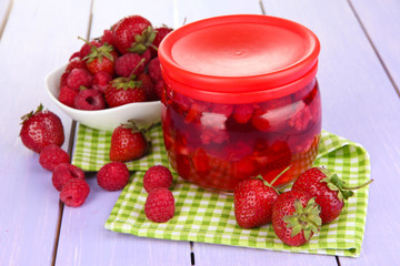 Home made berry jam on wooden table